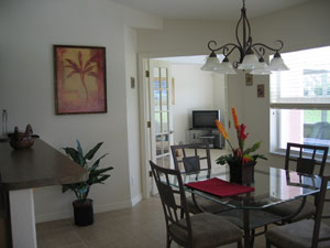 Casual dining in nook with view of family room