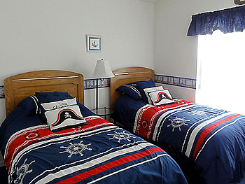 Twin Bedroom Overlooking the Pool Area