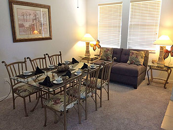 Formal Carpeted Dining Area with Comfy Seating
