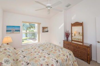 Double bedroom with fitted wardrobes, dresser and view over canal